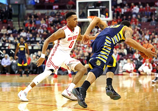 Freshman guard D'Angelo Russell (0) plays defense during a game against Marquette on Nov. 18 at the Schottenstein Center. OSU won, 74-63. Credit: Muyao Shen / Lantern photographer