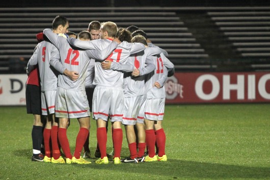Members of the OSU men's soccer team huddle during a game against Rutgers on Oct. 25 at Jesse Owens Memorial Stadium. OSU won, 4-1. Credit: Taylor Cameron / Lantern photographer