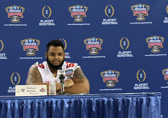 Senior defensive lineman Michael Bennett answers questions from the media during OSU's media day on Dec. 30 at the Mercedes-Benz Superdome in New Orleans. Credit: Mark Batke / Photo editor