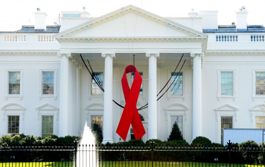 A red ribbon is displayed on the North Portico of the White House on Dec. 1, 2014, to commemorate World AIDS Day in Washington, D.C. Credit: TNS