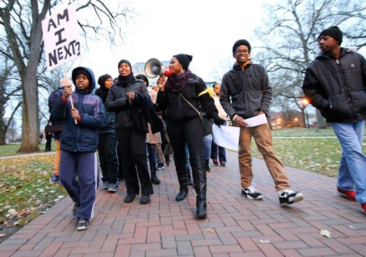 Protesters take to the Oval Monday, Dec. 8 to take a stand against the Ferguson decision and police brutality.  Credit: Yann Schreiber / Lantern reporter 