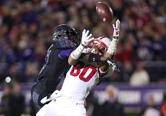 Northwestern Wildcats cornerback Matthew Harris (27) blocks Nebraska Cornhuskers wide receiver Kenny Bell (80) from making a catch during the second quarter at Ryan Field Oct. 18, 2014, in Evanston, Ill. Credit: Courtesy of TNS