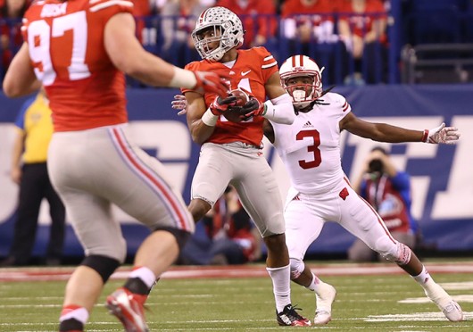Sophomore safety Vonn Bell (11) intercepts a pass from Wisconsin redshirt-junior quarterback Joel Stave during the Big Ten Championship Game on Dec. 6 in Indianapolis. OSU won, 59-0. Credit: Mark Batke / Photo editor