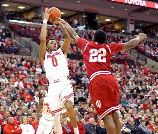 D’Angelo Russell (0) attempts a shot over Indiana sophomore guard Stanford Robinson (22) during a Jan. 25 game at the Schottenstein Center. OSU won, 82-70.  Credit: Samantha Hollingshead / Lantern photographer