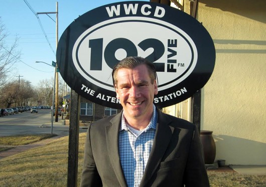Randy Malloy stands in front of the radio station he manages: CD102.5. Credit: Courtesy of Randy Malloy