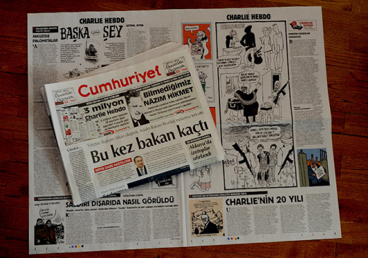 Turkish Newspaper Cumhuriyet printed a four-page selection of cartoons and articles on Wednesday in a show of solidarity with Charlie Hebdo but left out cartoons which Muslims may find offensive. However, two Cumhuriyet columnists Hikmet Cetinkaya and Ceyda Karan used small, black-and-white images of the Charlie Hebdo cover as their column headers in Wednesday's issue. Ankara, Turkey, January 14, 2015. Credit: Courtesy of TNS