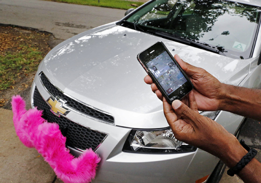 The Lyft app allows users to request a ride in Miami on June 4, 2014. Regulators across the U.S. and in Europe are struggling with how to control the digital-dispatch services that have upended the transportation business. Credit: Courtesy of TNS