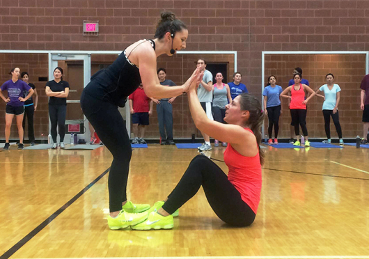 Alice Adams (left) and Stephanne Musser co-teach the Nike Fitness Training Club class Jan. 28 at the RPAC. The RPAC is the only location on campus to offer the class. Credit: Lee McClory / Design editor