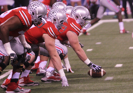 Members of the OSU offensive line prepare for a snap during a game against Wisconsin on Dec. 6 in Indianapolis. OSU won, 56-0.  Credit: Chelsea Spears / Multimedia editor