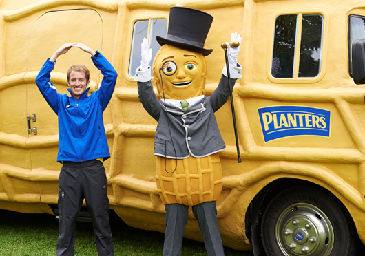 OSU alumnus Tom Shepherd poses with Mr. Peanut in front of the Planters NUTmobile. Credit: Courtesy of Kraft Foods Group