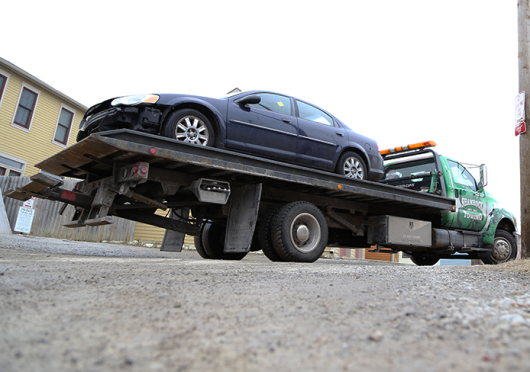 A Shamrock Towing, Inc. tow truck pulls into a vehicle storage location on Feb. 4 at 1145 Hamlet St. in Columbus. Credit: Mark Batke / Photo editor