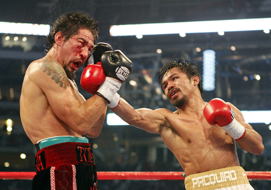 Manny Pacquiao (right) is set to fight the undefeated Floyd Mayweather for the first time on May 2. Credit: Courtesy of TNS