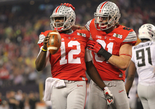 Then-redshirt-sophomore quarterback Cardale Jones (12) and then-redshirt-junior tight end Nick Vannett celebrate during the College Football Playoff National Championship against Oregon on Jan. 12. OSU won, 42-20. Credit: Mark Batke / Photo editor