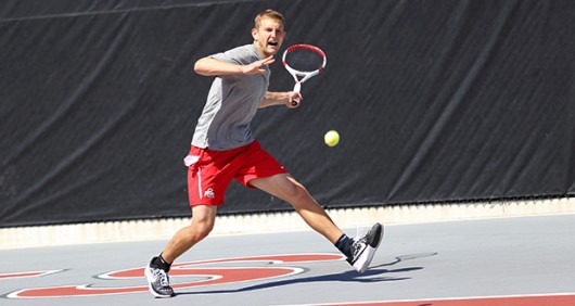 Senior Kevin Metka prepares to hit the ball during a match against Purdue on April 12 at the Varsity Tennis Courts. OSU won, 4-0. Credit: Mark Batke / Photo Editor