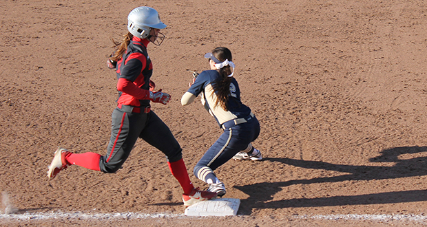 Senior outfielder Caitlin Conrad (left) arrives safely at 1st base during a game against Pittsburgh on March 31. OSU won, 7-3. Credit: Stacie Jackson / Lantern photographer