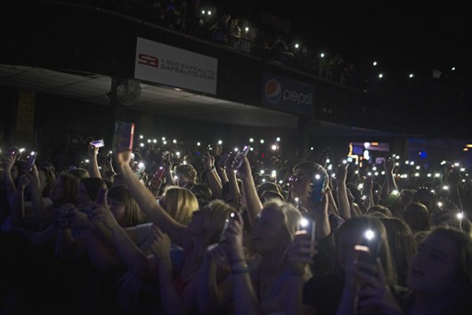 Fans hold up their phones as lights for a song during the Kodaline concert May 19 at Newport Music Hall. Credit: Judy Won / Lantern Photographer