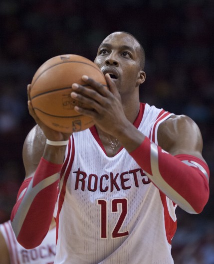 Dwight Howard (12) of the Houston Rockets shoots a free throw against the Sacramento Kings in the second half of the Rocket's 119-98 victory on Wednesday, Jan. 22, 2014, in Houston. Credit: Courtesy of TNS