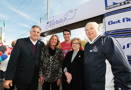 The Tiberi family at the 2014 Maria’s Miles event at the finish line. From left to right: Dom, Terri, Dominic, Louis and Betty Tiberi. Credit: Courtesy of M3S Sports