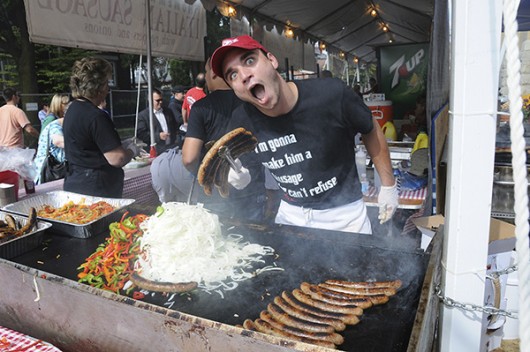 A cook prepares food or festival guests during the Italian Fest in 2013. Credit: Courtesy of Alise Cua