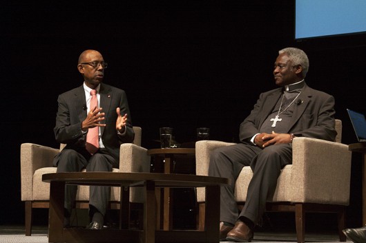 Cardinal Peter Turkson and University President Michael Drake during a “fireside chat” in Mershon Auditorium at OSU on Nov. 2. Credit: Kyle Powell | Design Editor