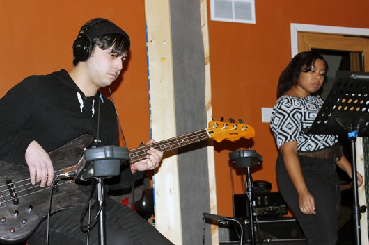 Bassist Raad Shubaily and vocalist Marnée Richardson are deep in concentration during valuable recording time. Credit: Zak Kolesar | Lantern Reporter