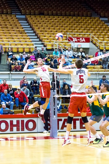 OSU redshirt sophomore middle blocker Matt Dorn (15) prepares to hits the ball during a game against George Mason at St John Arena on Jan. 15. Credit: Ed Momot | For The Lantern