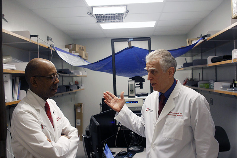 OSU President Michael Drake and Dr. Ray Hershberger chat during a tour of the Wexner Medical Center on Feb. 24. Credit: Jay Panandiker | Engagement Editor