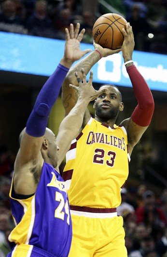 The Cleveland Cavaliers' LeBron James (23) puts up a shot during a game against the Los Angeles Lakers' Kobe Bryant in Cleveland on Feb. 10. Credit: Courtesy of TNS