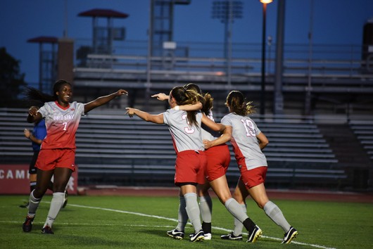 Then-junior forward Nichelle Prince (7) celebrates with teammates after a goal during a game against Minnesota on Sept. 17. Credit: Sam Harris | For The Lantern