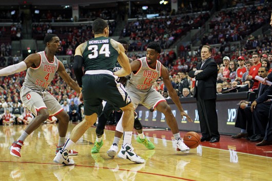 OSU freshman guard JaQuan Lyle (13) controls the ball during a game against Michigan State on Feb. 23 at the Schottenstein Center. Credit: Samantha Hollingshead | Photo Editor