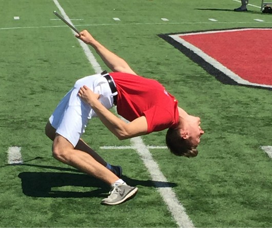John LaVange, the newly announced 2016-2017 drum major of the Ohio State marching band, performs a back bend during his tryout for the position at the Harmon Family Football Park on April 24. Credit: Michael Ittu | For The Lantern