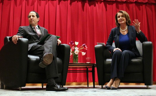 Moritz College of Law dean Alan Michaels (left) and House Minority Leader Nancy Pelosi (right) speak at Saxbe Auditorium on April 22. Credit: Michael Huson | Campus Editor