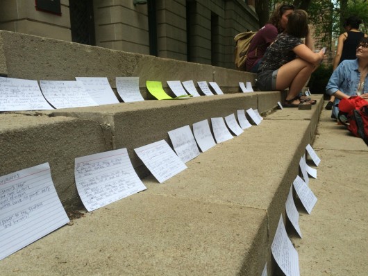 #ReclaimOSU protesters leave notes on the steps of Bricker Hall at Ohio State on April 26. Credit: Nick Roll | For The Lantern