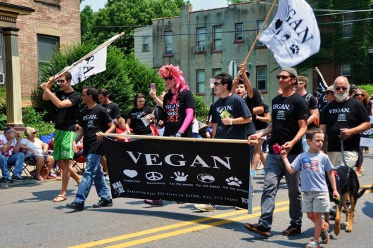 Vegans carry a banner along the parade route for Doo Dah Parade 2015. Credit: Courtesy of Doo Dah Parade
