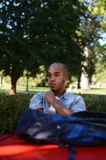 Abdul Razak Artan sits pensively on the Oval. Credit: Kevin Stankiewicz | Oller Reporter