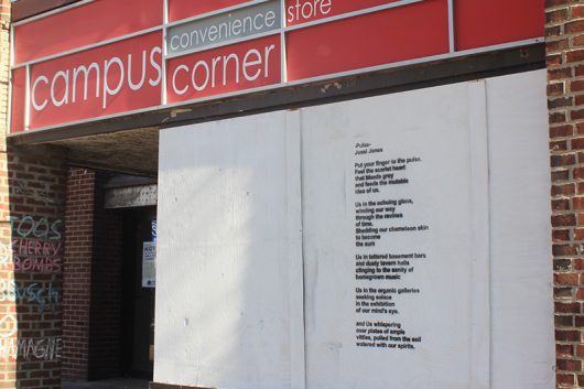 A stencil art installation entitled ‘Pulse’ has been placed at the vacant Campus Corner convenience storefront in part of the University District Arts and Character Enhancement Plan. Artist and OSU Alumni Jessica Jones created the poem inspired by her love of Columbus and the vibrancy of its neighborhoods. Credit: Grace Fleisher | Lantern Reporter