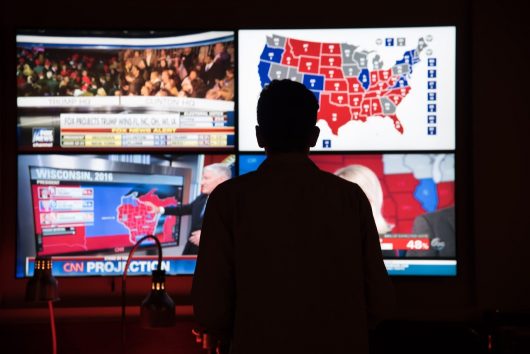 A student watches projections roll in at an election watch party in the Ohio Union on Nov. 8. Credit: Sam Harris | Assistant Campus Editor