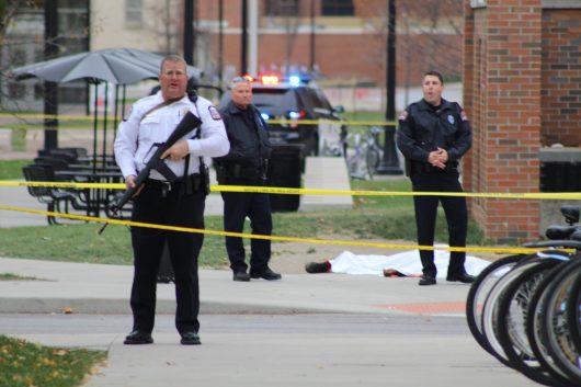 Police officers stand near the body of Abdul Razak Ali Artan, lying near the Chemical and Biomolecular Engineering Chemistry building on North Campus. Credit: Mason Swires | Assistant Photo Editor