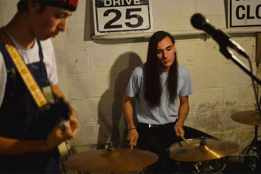 Michael Shuman and Dylan Reese practice for a gig for their band Inner Mikey. Credit: Adrien Lac | Lantern reporter