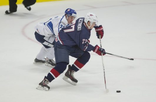Laczynski skates against a Finnish defender in the 2016 USA evaluation camp. Credit: Courtesy of USA Hockey