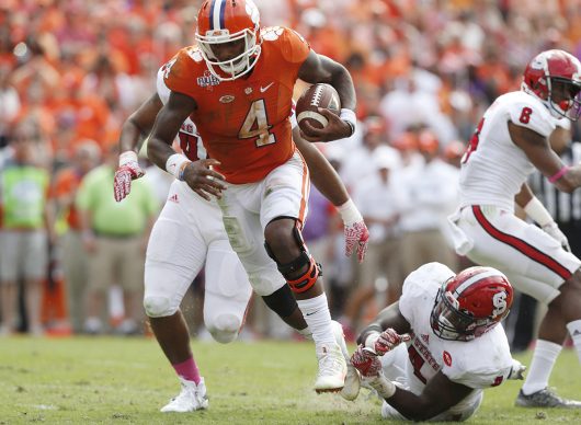 Clemson quarterback Deshaun Watson (4) scrambles in for 4-yard touchdown run during the second half against North Carolina State at Memorial Stadium in Clemson, S.C., on Saturday, Oct. 15, 2016. Clemson won, 24-17, in overtime. (Ethan Hyman/Raleigh News & Observer/TNS)